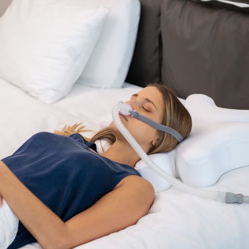 Woman sleeping with CPAP Ergonomic Pillow