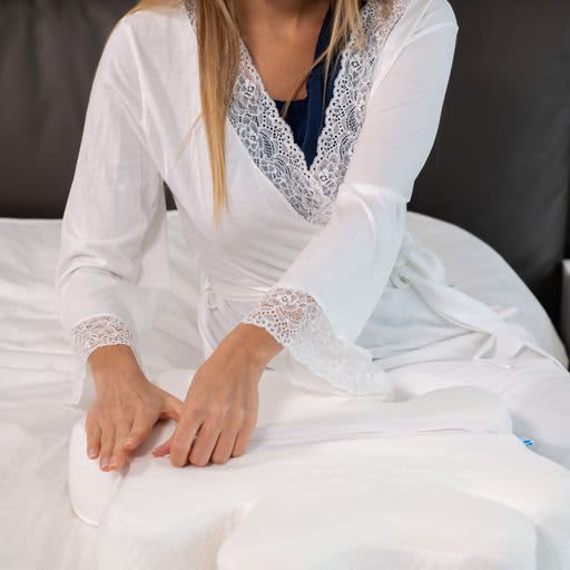 Woman preparing her CPAP Ergonomic Pillow 