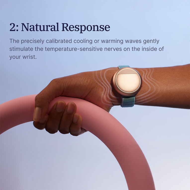 Hand wearing the Embr Wave 2 device, showing natural thermal response on the inside of the wrist.